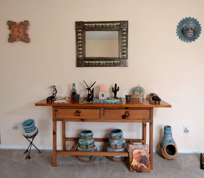 Rustic console table for sale along with lots of southwest pottery. Carved wooden eagle plague also for sale.