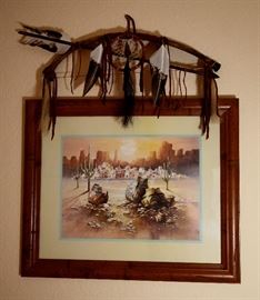 Fantastic framed southwest art with feathered bow and arrow topper.