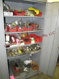 52 - Contents of cabinet: automotive parts, valves,
13 Image(s) gears, springs, nuts, bolts, 2 - cyl blocks & other misc (NO CABINET)