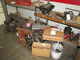 19 - Scrap metal ON 2 sections of shelving (NO shelving) engine blocks, cranks, heads, hitch, muffler & other misc