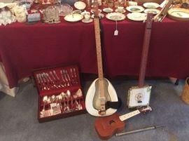 Unusual banjos. And a ukulele and silver plate serving set.  