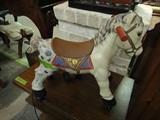 Vintage child's ride on toy horse, rolls
