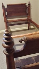 Original Rope Bed.
This solid wood, one of a kind handmade bed, is similar to a twin size bed. Rich in history, this antique can be used every day for youngsters, or as a decorative conversation piece. Modifications were made mid-century to include horizontal slats, to accomodate a board & mattress. Changes can easily be reversed, or used as is!