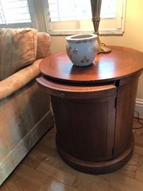 One of two Drum tables with pull out shelf