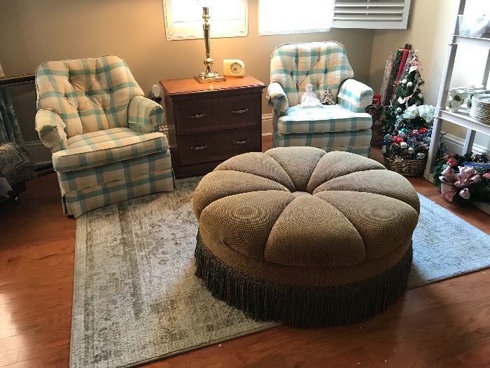 Club chairs, area rug and round ottoman