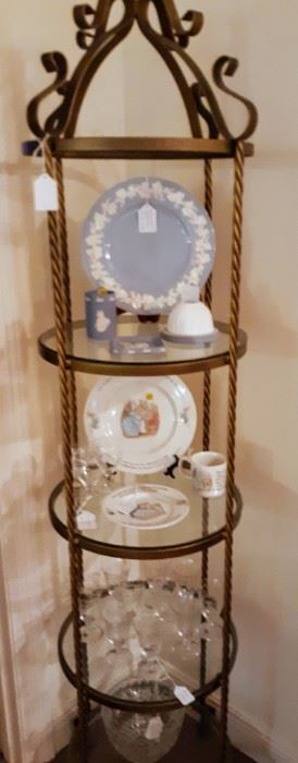 Tall four shelf metal and glass etagere. Jasperware Peter Rabbit cup and tray, Luminary, Beatrix Potter large and small plate, and cup.  Elegant etched glasses...