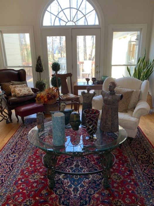 Beautiful traditional leather furniture, double sided signed Persian rugs, multiple glass top and wooden coffee tables, artwork and pottery, stonework sculptures, indoor plants and more. 