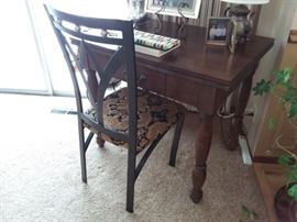 Pretty wooden conversion table. Pictured with metal art deco style chair.
