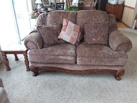 Lovely brown with gold accents Ashley Furniture love seat.