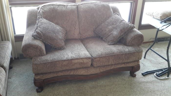 Lovely brown with gold accents Ashley Furniture love seat.