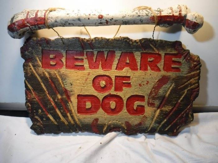 Beware of dog sign with giant bone