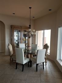 glass top dining room table and chairs ( four modern white chairs and two tapestry) Large china cabinet 