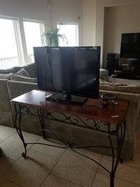small sofa/console table and flatscreen TV ( sold separately)