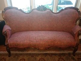 Beautiful carved sofa with very clean upholstery.