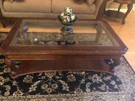 Fancy glass top coffee table--why do they call it a coffee table, BTW? I NEVER place coffee on these tables. They should call it a WINE table!