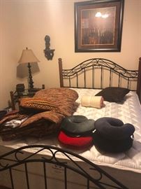 Iron bed and enough neck pillows to share with all other passengers on the plane!