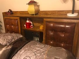 Those cool Chesterfield leather headrests slide back and forth.