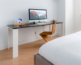 Kartell table - black top with white legs Dimensions: 50.4''L x 50.4''W x 28.33''H  Weight: 121.25 lbs