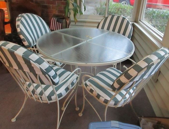 white metal patio table and chairs (never outside)