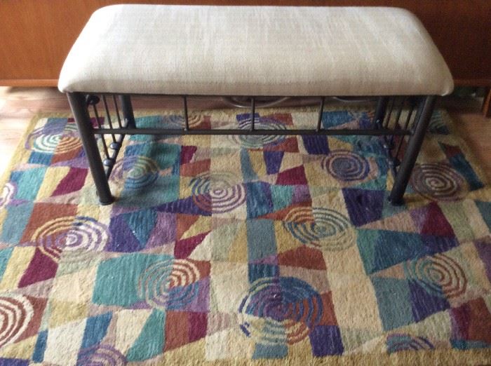 Bedside stool and area rug.