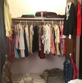 More blouses, shells, sleeveless blouses, skirts, sweatpants, most with tags.