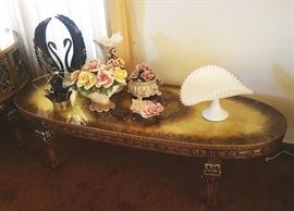 Hollywood Regency coffee table, cool swan figures, some never-displayed Capidomonte pieces, Fenton Silver Crest banana stand