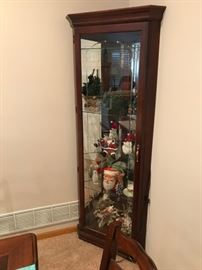 Mirror back, corner curio cabinet in rich mahogany. Giving your collectables more visual depth.
