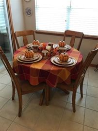 Round kitchen table with marble top and 4 upholstered seat chairs