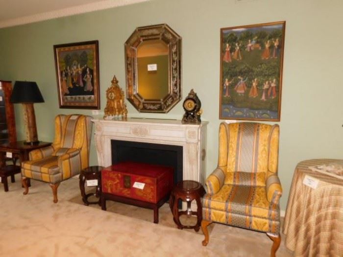Venetian mirror, two clocks, painted parchment chest, pair of wingback chairs
