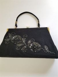 Black flower decorated handbag