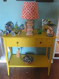 Gold console table, fish