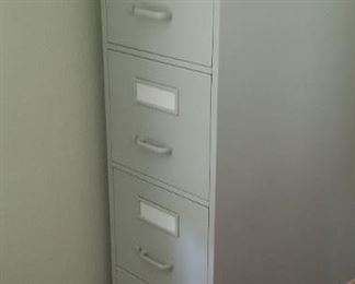 Several 4 drawer filing cabinets