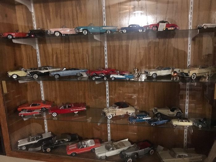 Many Franklin Mint and Danbury mint collectible cars. 