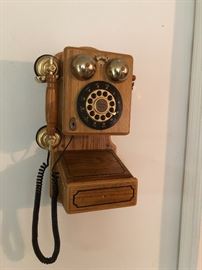 Thomas reproduction wall phone.  Has touch tone buttons