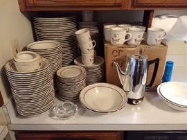 Cumberland everyday stoneware dishes by mayblossom. There are 48 plates, 58 mugs,57 coffee plates, one sugar dish, 2 large bowls, 49 bowls,10 small plates.