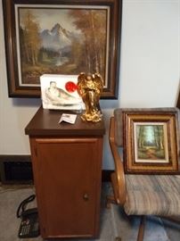 Paintings, cabinet, statues and chair that swivels
