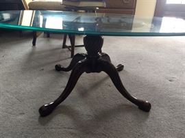 glass table with wooden legs