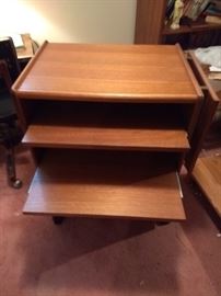 Rolling table with  shelves and side leaf