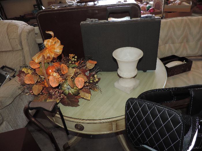 round table, vintage luggage 