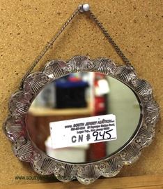  Fancy Silver Marked Ceylan Ladies Ornate Hanging Mirror

(approximately 6 1/2” W x 5” H x ½” D)

auction estimate $100-$300 