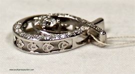 10 Karat White Gold Pendant with approximately .25 Diamonds – auction estimate $200-$400 