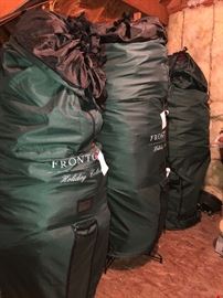 Three pre-lit Christmas trees in Frontgate Storage bags-One tree is Frontgate brand, various sizes 7-9 feet