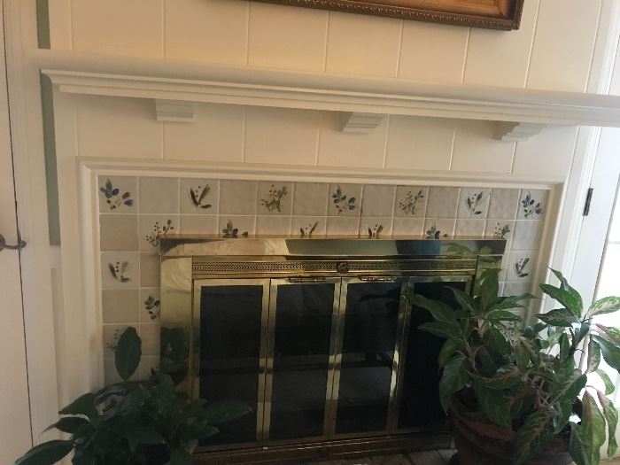 Brass fireplace screen and white mantle 