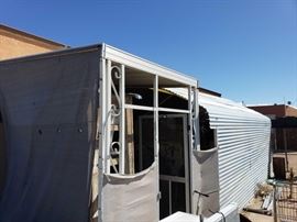 #91: Metal Car Port with Coragated Metal 21' x 11' x 10' with Additional Shade
Metal Car Port with Coragated Metal 21' x 11' x 10' with Additional metal Shade Does not include items inside. Also includes original plastic tarp for car port