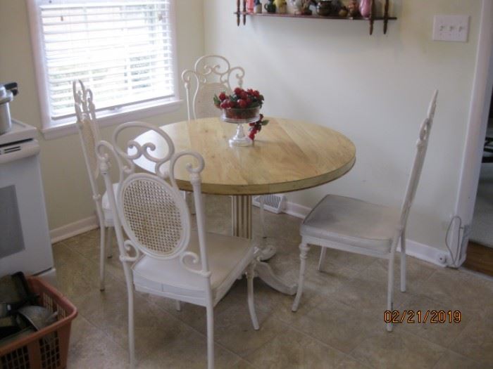 White Metal Chairs, heavy construction with round pedestal table, laminate top