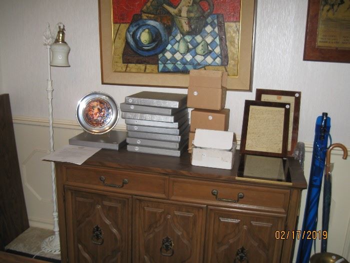 Small buffet and pewter and stained glass plate collection.Lights for mounting plates.