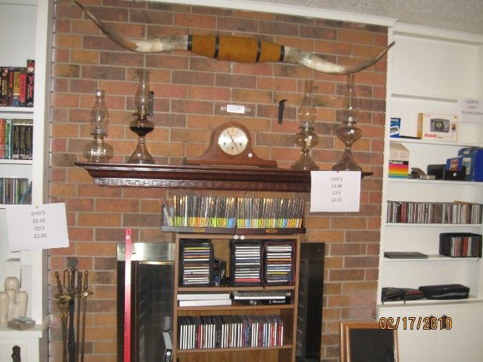 CD's, many unopened, great long horns, working mantle clock and old oil lamps.