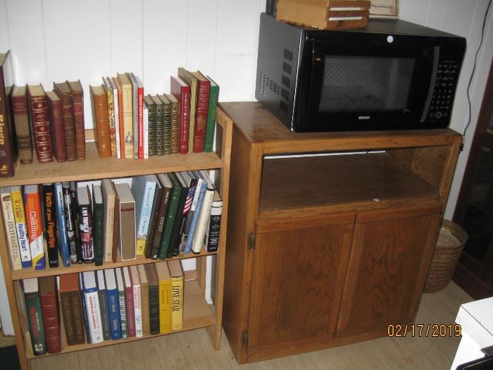 Some very nice old Texas books plus novels.  Very nice microwave cabinet.
