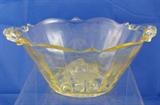 This is a rare "Patrick" pattern Yellow Depression Glass Bowl with Handles. It is a rare light Yellow color which is highly collectible with a lattice work bottom. 
Condition:Very Good
Size:9"(including handles)
Shipping:Yes