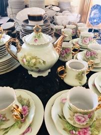 Left on vintage hand painted tea set
